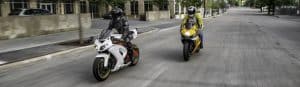 picture of two riders on metric bikes for motorcycle oil article