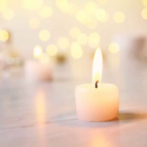 image of a votive candle on a floor
